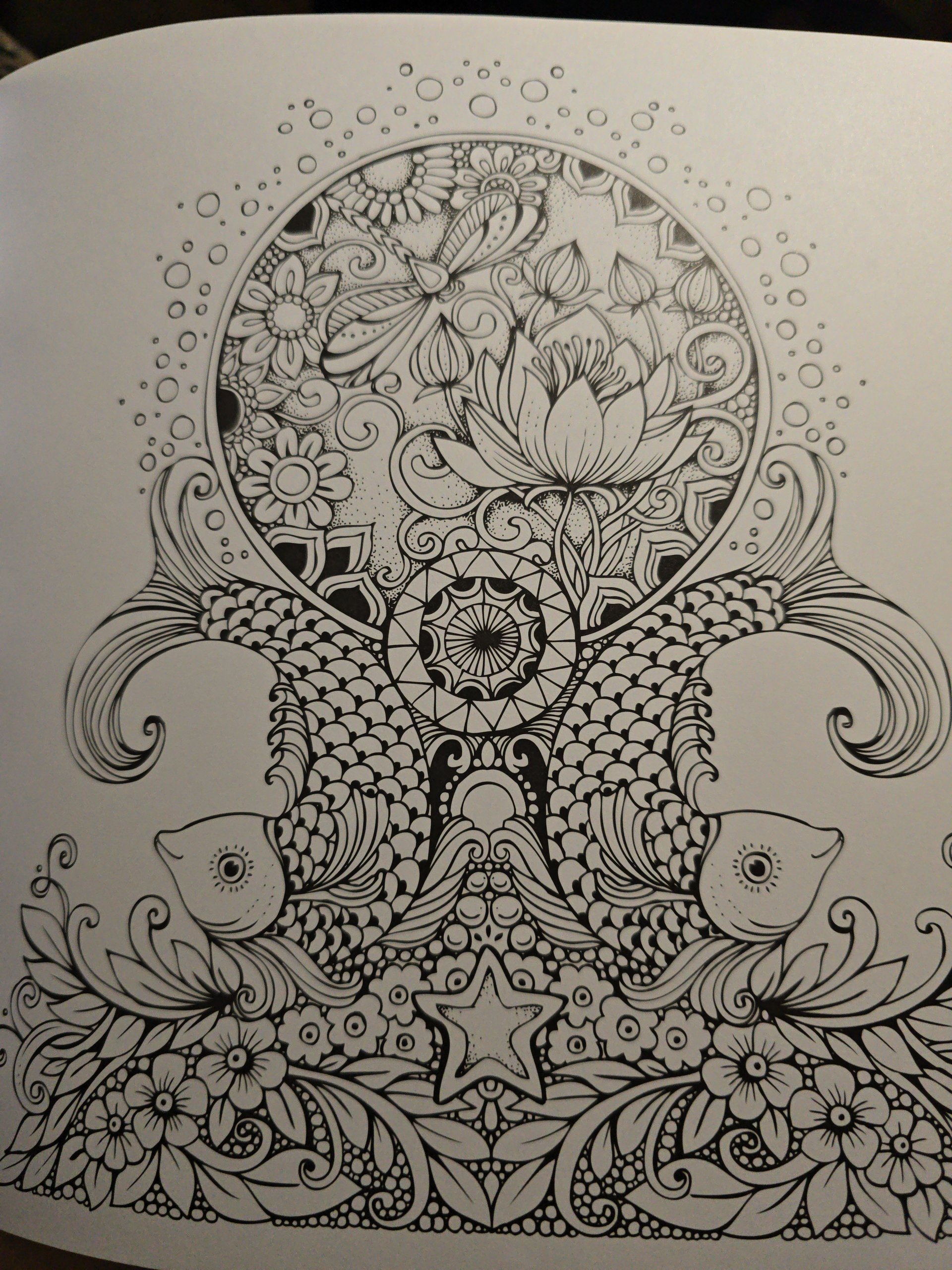 Intricate folk art coloring page featuring flowers and patterns