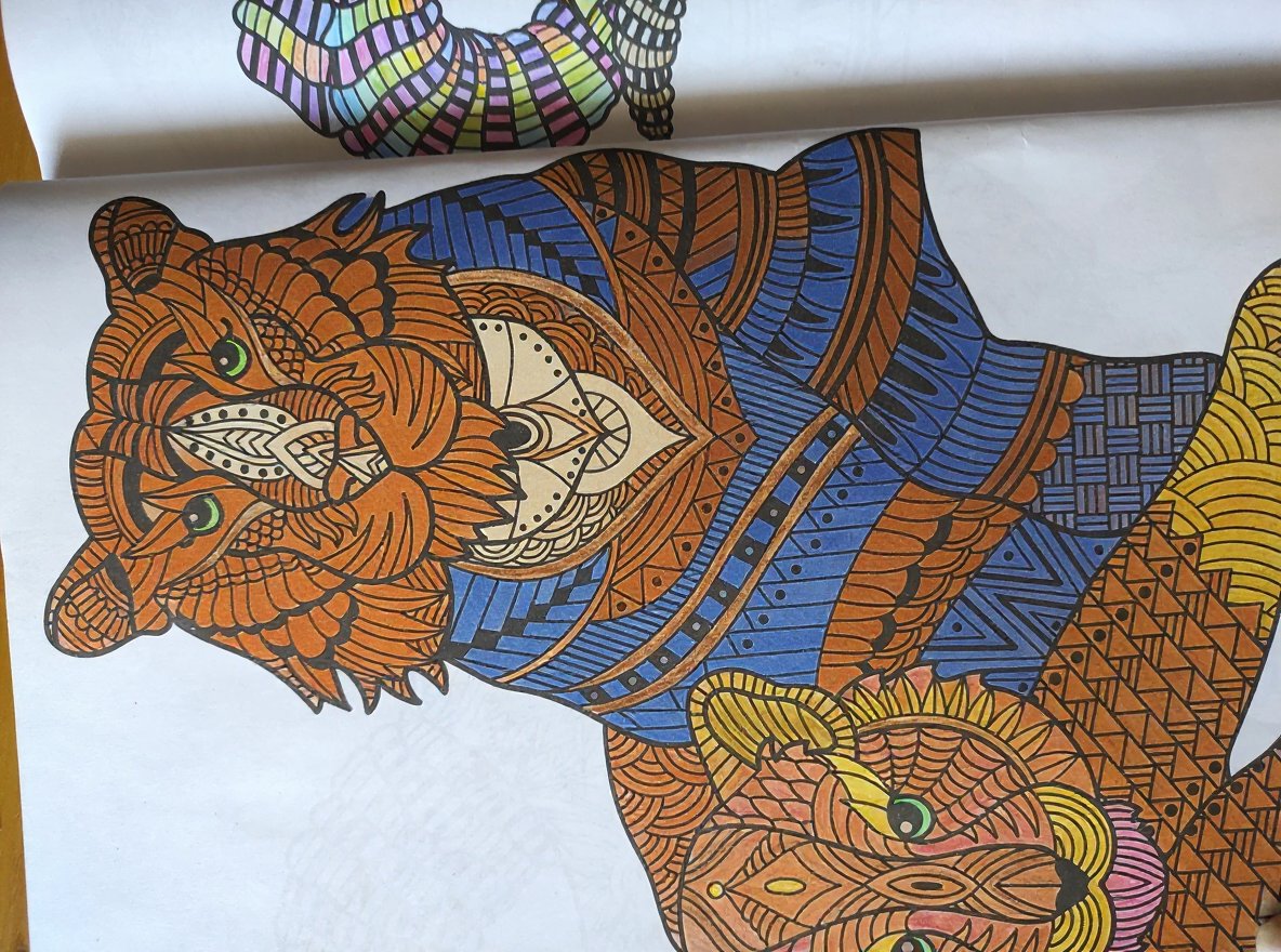 Intricate life-themed coloring page featuring wildlife